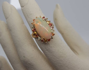 Ethiopian Opal Halo Ring with Multi Color Sapphires in 14kt. Yellow Gold Handmade Designer Halo Ring
