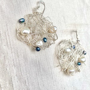 Round fresh white and black water pearl and  bead earrings