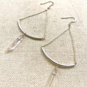 Silver arch balance dangle earrings with clear quartz