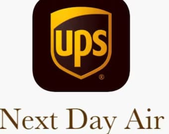 May include: A brown square app icon with a gold shield-shaped logo featuring the word "ups" in all caps. The text "Next Day Air" is below the icon in brown.