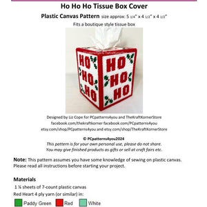 May include: A plastic canvas pattern for a tissue box cover. The pattern features a red and white design with the words "Ho Ho Ho" and holly leaves. The pattern is approximately 5 1/4 inches by 4 1/2 inches by 4 1/2 inches.