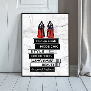 May include: A black and white illustration of a pair of red high heels on a stack of books. The books have titles related to fashion, including "Fashion Guide", "Mode Chic", "Style", "French Designers", "Haute Couture", "Beauty", and "History of Fashion".