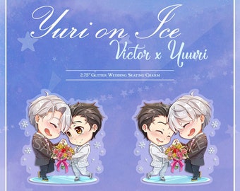May include: A 2.75 inch glitter wedding skating charm featuring two cartoon figures in wedding attire. The figures are holding a bouquet of flowers and are standing on a skating rink. The charm is titled "Yuri on Ice Victor x Yuri".