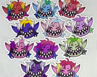 May include: Ten colorful stickers featuring cartoon trolls with different expressions. Each sticker has a different color scheme and features a troll with large teeth and pointy ears.