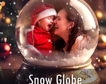 May include: A glass snow globe featuring a base with embossed leaf patterns and the text Snow Globe. Inside the sphere, a child wearing a red Santa hat and jacket laughs alongside an adult, surrounded by white snow particles and warm lighting.