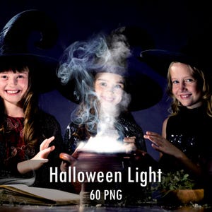 May include: Three children wearing black pointed witch hats and dark clothing gathered around a central dark cauldron emitting bright white smoke. The image includes the text Halloween Light 60 PNG centered at the bottom of the frame.