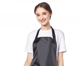 Black Waterproof Soft PVC Apron with Adjustable Neck Strap and Front Pockets, Wipeable and Sanitizable