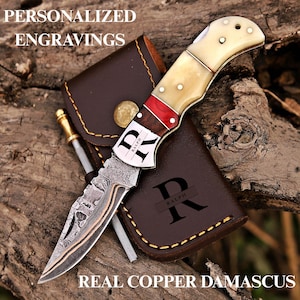 Copper Damascus Pocket Knife With Personalized Engravings And Leather Sheath. Knife Has Bone Handle And Offer Custom Engraving Which Makes It perfect Groomsmen Gift