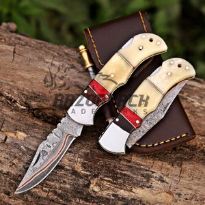 personalized pocket knife with bone handle and copper damascus blade which comes with leather sheath, you can customize  it for gifting to groomsmen