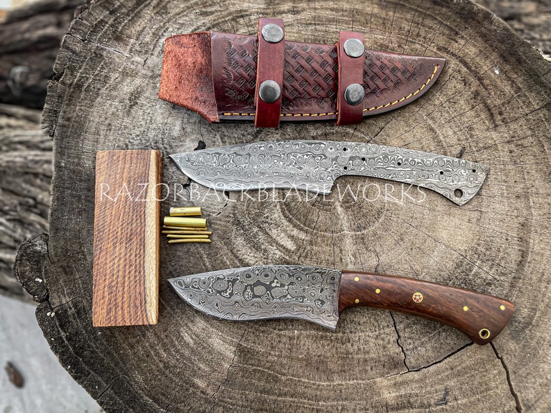 damascus knife making kit, which includes a damascus blank and wood scales for the knife handle, this knife making kit is best for people who are into knife making and looking for a kit to experiment there knife making skill. the knife kit also comes with a leather sheath