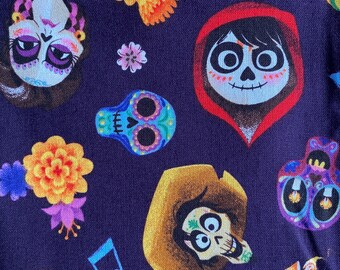 May include: Purple fabric with a repeating pattern of characters from the movie Coco. The characters include Miguel, Hector, and Mama Imelda. The fabric also features sugar skulls, marigolds, and musical notes.