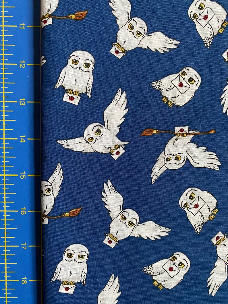 May include: White owls with yellow eyes and red wax seals on envelopes fly against a blue background. The owls are carrying letters and a broom.