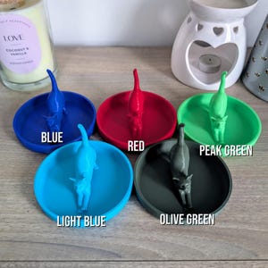 May include: Five ring dishes in different colors: blue, red, light blue, olive green, and peak green. Each dish features a 3D printed cat figurine.