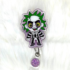 Interchangeable or permanent glitter Beeltejuice badge reel