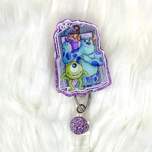 Interchangeable or permanent glitter Monsters badge reel