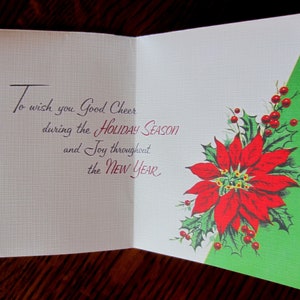 May include: A vintage Christmas card with a red poinsettia and green holly leaves on a green background. The card reads "To wish you Good Cheer during the HOLIDAY SEASON and Joy throughout the NEW YEAR."
