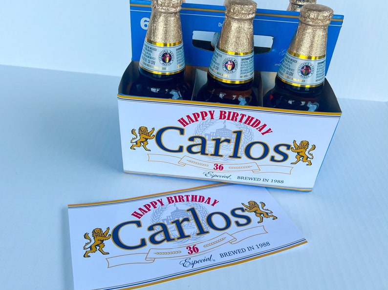 May include: A six-pack of beer with a personalised label that says "Happy Birthday Carlos 36 Especial Brewed in 1988".