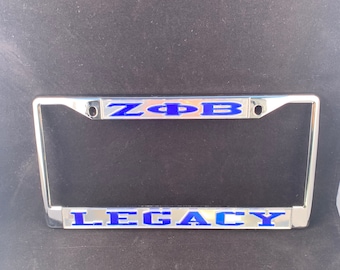 Cultural Exchange Zeta Phi Beta Finer Womanhood License Plate Frame Silver Standard Frame - Silver/Blue - Car/Truck Cultural Exchange Zeta Phi Beta Finer Womanhood License Plate Frame Silver Standard Frame - Silver/Blue - Car/Truck