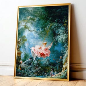 May include: A framed print of a Rococo painting showing a woman on a swing in a garden. The artwork has a gold frame, a woman in a pink dress, and figures in a garden with trees and a blue sky, reminiscent of the 18th century.