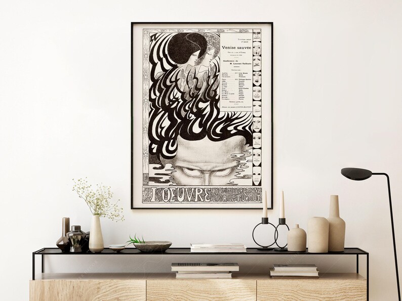 May include: Black and white poster featuring a graphic design of a face with a swirling pattern. The poster has the text "L'OEUVRE" at the bottom and "Venise sauv&eacute;e" at the top.