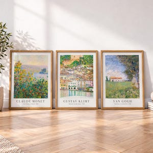 May include: Three framed art prints in light wood frames. The left print is Claude Monet's Flower Beds at Vétheuil, the center is Gustav Klimt's Malcesine on Lake Garda, and the right is Van Gogh's Farmhouse in a Wheatfield.
