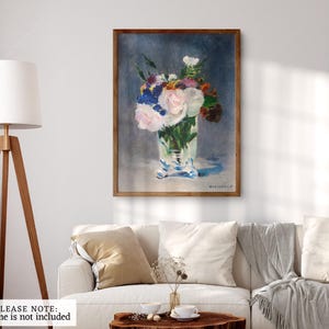 May include: A painting of a bouquet of white, pink, and blue flowers in a clear glass vase. The flowers are arranged in a loose, natural style, and the vase is decorated with a delicate pattern. The background is a soft blue.
