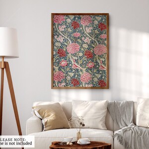 May include: A framed print of a floral pattern with pink, red, and white flowers on a blue background.