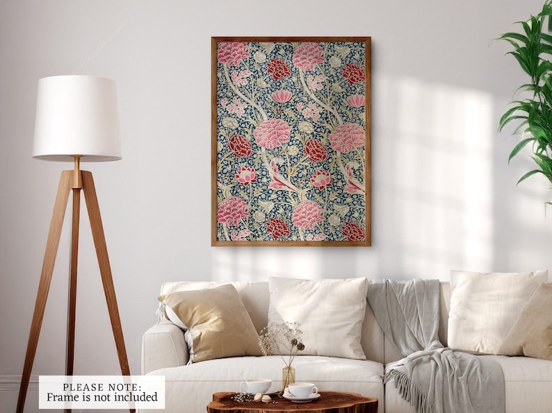 May include: A framed print of a floral pattern with pink, red, and white flowers on a blue background.