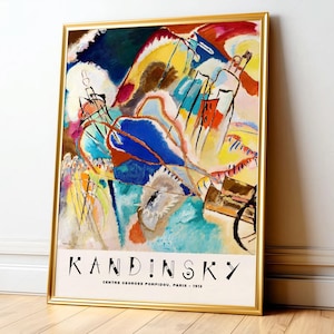 Modern abstract art featuring a dynamic composition of swirling shapes and vibrant colors, including deep blues, fiery reds, and sunny yellows, creating a sense of movement and energy. The textured brushstrokes and layered forms evoke an emotional response, while the bold outlines add structure to the fluidity of the piece. This captivating artwork by Kandinsky, is framed and displayed on a living room wall, enhancing the space with its striking visual narrative. Printed poster wall art.