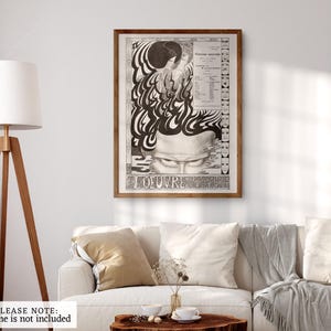 May include: A black and white poster with a psychedelic design featuring a face with closed eyes and the text "L'OEUVRE" at the bottom. The poster is framed in a brown wood frame.