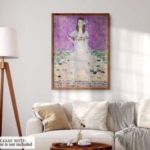 May include: A painting of a woman in a white dress with a floral pattern. She is standing in a field of flowers with a purple background. The painting is framed in a wooden frame.