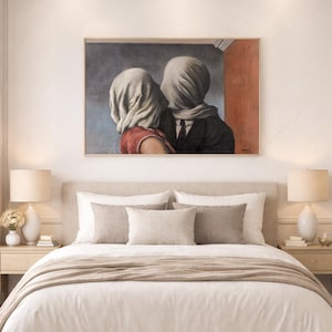 May include: A rectangular wall art print featuring a reproduction of The Lovers by Rene Magritte. The painting depicts two figures with their heads covered in white fabric, one wearing a red top and the other a dark suit, set against a blue and red wall.