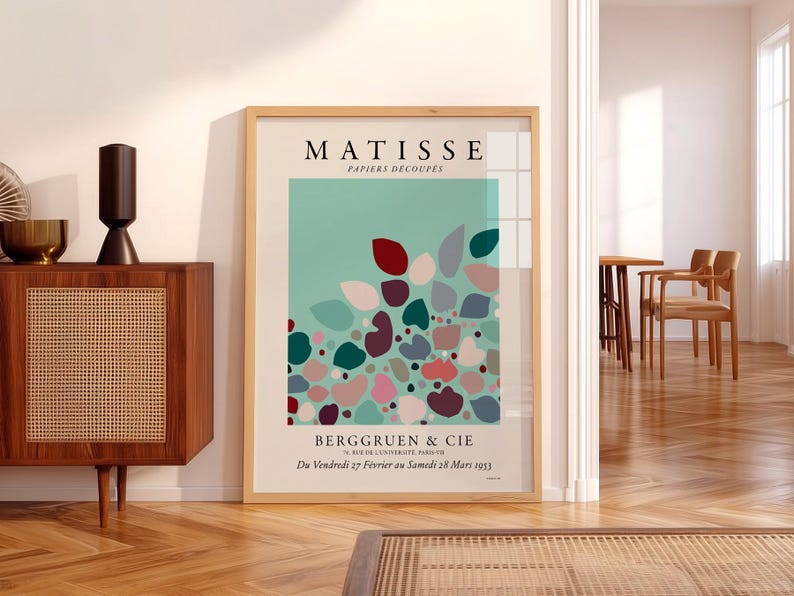 Henri Matisse Modern abstract art featuring a vibrant composition of soft, rounded shapes in shades of teal, coral, and deep burgundy, interspersed with muted pastels. The artwork exudes a playful yet sophisticated mood, with organic forms creating a sense of movement and flow across the canvas. Subtle textures and layered colors enhance the depth, inviting viewers to explore the interplay of light and shadow. Elegantly displayed on a living room wall, this printed poster wall art beautifully