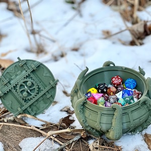 May include: A green, 3D printed, octopus-shaped dice tower with a removable lid. The tower is filled with colorful dice.