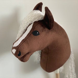Brown Hobby Horse with white mane