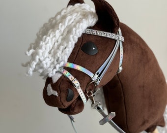 Brown Hobby Horse with white mane and opalescent bridle and reins