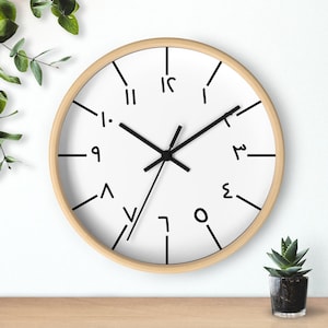 May include: A white clock with black Roman numeral markings and black hands. The clock has a wooden frame.
