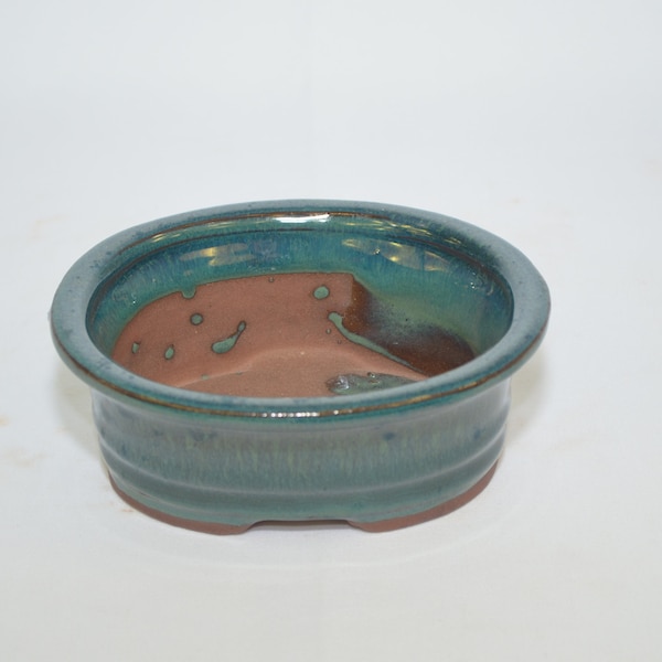 Bonsai ceramic pot 5", teal color, oval shape with draining holes.