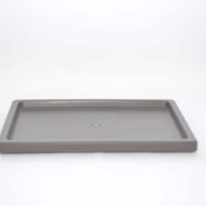 May include: A gray rectangular tray with a raised edge.
