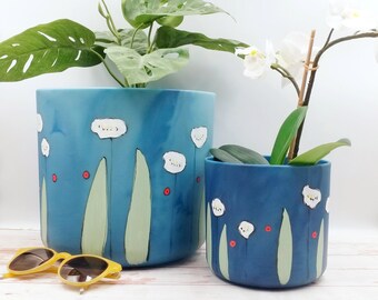 Large plant pots made of recycled plastic from maritime waste, hand painted design