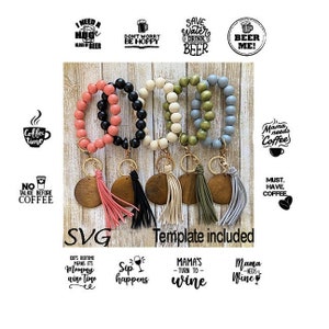 May include: A set of five beaded bracelets with wooden charms and tassels. The bracelets are in various colors, including pink, black, white, green, and blue. The charms are round and have a wood grain pattern. The tassels are in matching colors. The bracelets are labeled with various phrases, including "Coffee Time", "No Talkie Before Coffee", "Mama Needs Coffee", "Must Have Coffee", "I Need a Huge Glass of Beer", "Don't Worry Be Hoppy", "Save Water Drink Beer", "Beer Me!" and "Kids Bedtime Means It's Mommy Wine Time", "Sip Happens", "Mama's Turn To Wine", and "Mama Needs Wine".