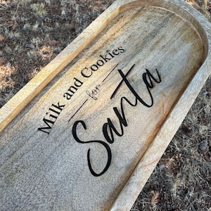 May include: A wooden serving tray with the text "Milk and Cookies for Santa" engraved on the surface.