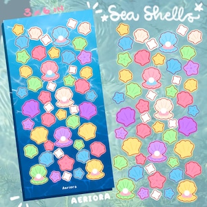 May include: Two sheets of stickers featuring colorful sea shells and starfish on a blue background. The stickers include various pastel colors like pink, yellow, green, and purple. The text "Sea Shells" is written at the top. The sticker sheet measures 3 x 6 inches.