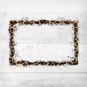 May include: A white wood background with a leopard print frame. The frame is gold and black with a white background. The frame is slightly distressed.