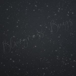 May include: A dark blue background with a scattered pattern of white glitter resembling stars.