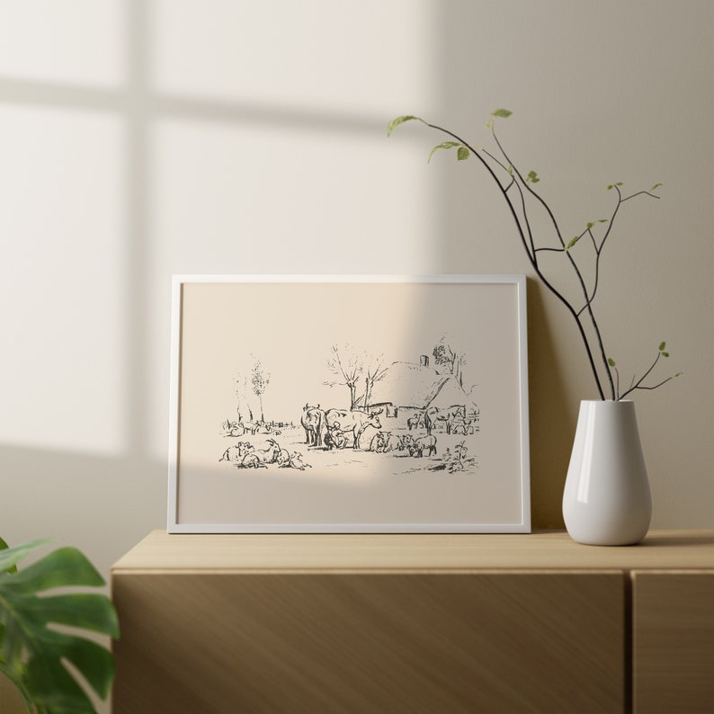 Pu&ograve; includere: Una stampa orizzontale incorniciata che presenta un disegno a tratto con inchiostro nero su sfondo color crema. L'opera raffigura una scena di fattoria rurale con diverse mucche che pascolano in un campo vicino a un piccolo cottage e alberi. La cornice &egrave; sottile, bianca e rettangolare.