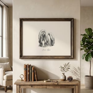 May include: A framed wall art print featuring a detailed charcoal-style sketch of a Lhasa Apso dog centered on a cream background, with the text "Lhasa Apso" printed in a black script font directly below the illustration of the long-haired dog.