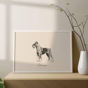 May include: A rectangular white frame containing a beige print with a black and white sketch of a Schnauzer dog in profile. The word Schnauzer is written in a cursive script font below the dog illustration within the frame.