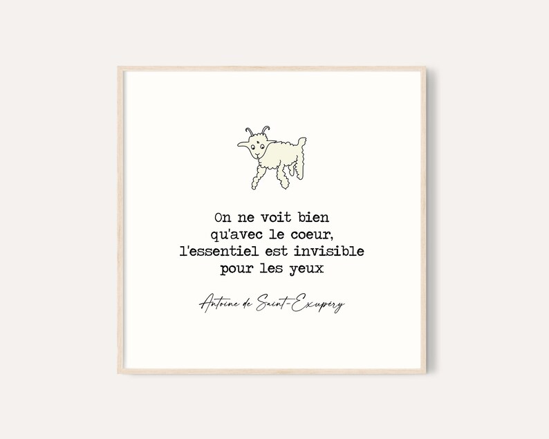 Puede incluir: Impresi&oacute;n enmarcada con una ilustraci&oacute;n de cabra de dibujos animados y una cita en franc&eacute;s. La cita, de Antoine de Saint-Exup&eacute;ry, dice: &laquo;On ne voit bien qu'avec le coeur, l'essentiel est invisible pour les yeux&raquo;. Fondo blanco.