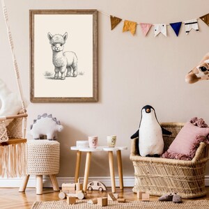 May include: A framed black and white line art drawing of an alpaca hanging on a wall above a children's room featuring a macrame swing, a woven rattan chair, a plush penguin, a tall giraffe stuffed animal, and a small wooden table.